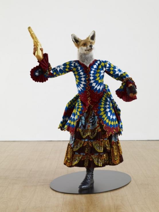YINKA SHONIBARE, MBE; Revolution Kid (fox girl), 2012; mannequin, Dutch wax printed cotton, fibreglass, leather, taxidermy fox head, steel base plate, BlackBerry and 24 carat gold gilded gun
44 x 36 x 30 inches © The Artist / Courtesy James Cohan Gallery, New York/Shanghai